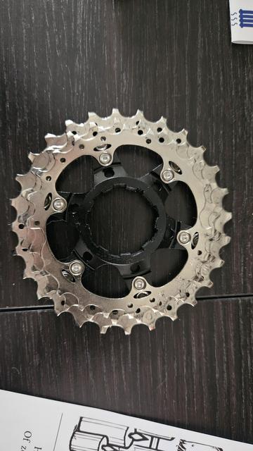 A photo of the three largest sprockets on a road-bike cassette.